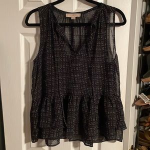 Navy blue and white sleeveless blouse